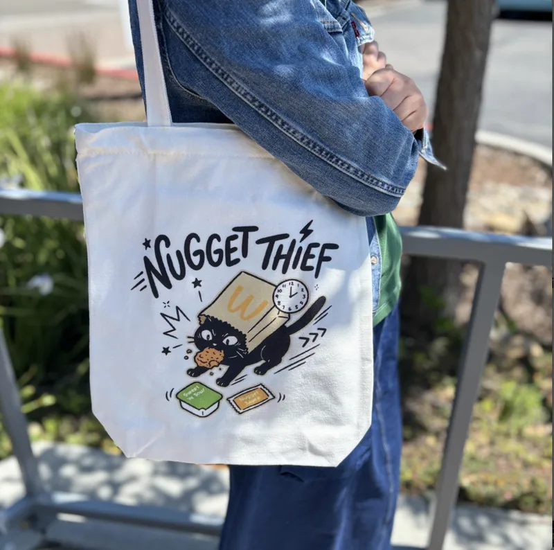 Black cat apparel, totes, and accessories from Nyangi Studio USA