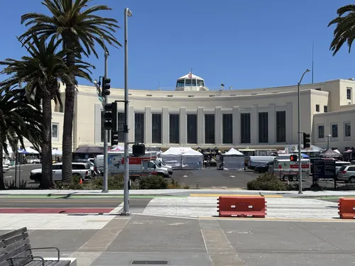 Vendor tents set up in front of the historic Art Deco Building One on Treasure Island