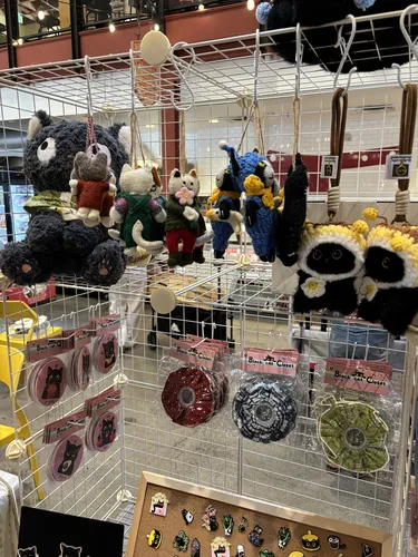 Wool-felt cat plush and ornaments, button badges, fabric scrunchies, and enamel pins