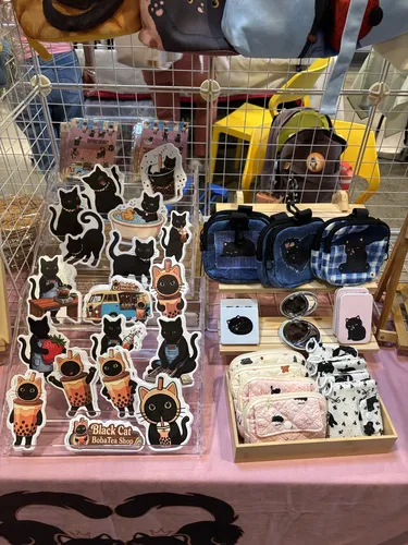 Black Cat Boba Tea die-cut stickers, denim crossbody pouches, compact mirrors, and quilted coin purses